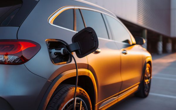 Image showing an Electric Vehicle being charged. 